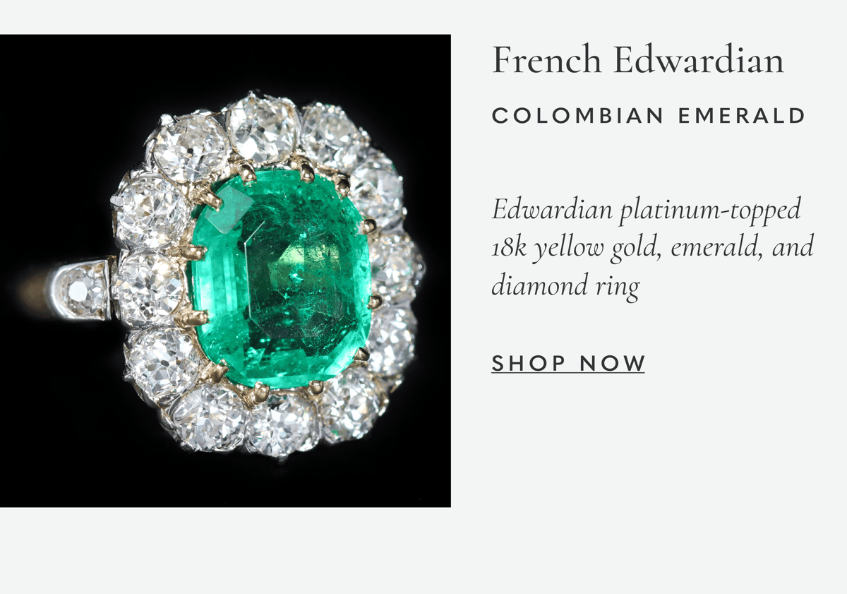 Edwardian platinum-topped 18k yellow gold, emerald, and diamond ring. Shop now >